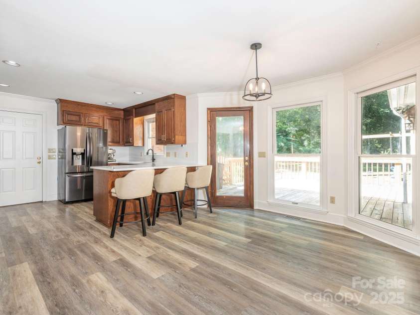 1231 Bennington Drive, Concord, NC 28027.  MLS# CAR4285344, YatesRealty ID 33260. BREAKFAST AREA OPEN TO KITCHEN LOOKING OUT TO BACK YARD