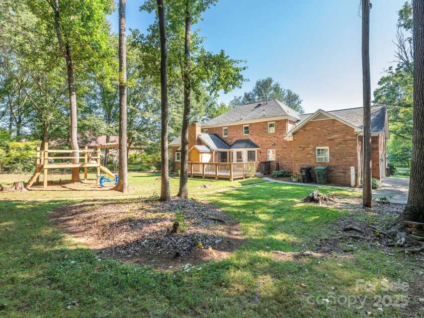 1231 Bennington Drive, Concord, NC 28027.  MLS# CAR4285344, YatesRealty ID 33260. HUGE PRIVATE BACK YARD ON ALMOST 1 ACRE!