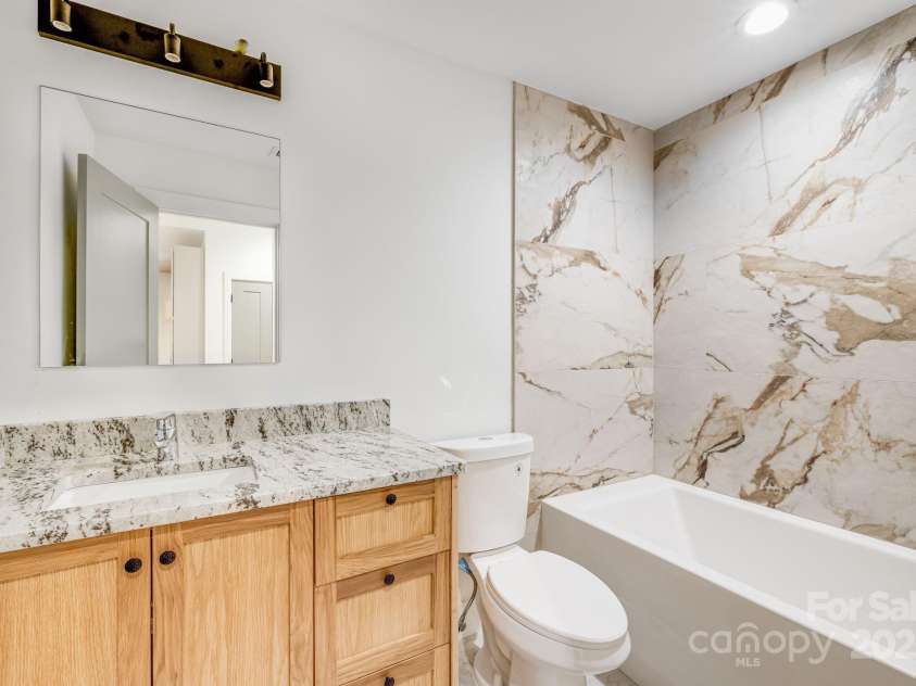 70 Teague Road, Marshall, NC 28753.  MLS# CAR4290135, YatesRealty ID 33263. Designer Tile in Shared Second Bath 