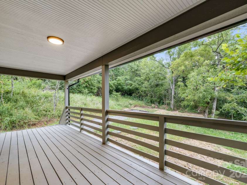 70 Teague Road, Marshall, NC 28753.  MLS# CAR4290135, YatesRealty ID 33263. Private Covered Deck off the Primary Suite 
