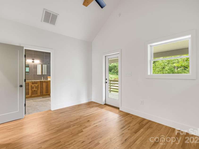 70 Teague Road, Marshall, NC 28753.  MLS# CAR4290135, YatesRealty ID 33263. With Walkout to a Covered Rocking Chair Porch 