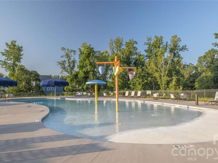 404 Sensibility Circle, Fort Mill, SC 29708.  MLS# CAR4387912, YatesRealty ID 33266. Neighborhood Splash Pool