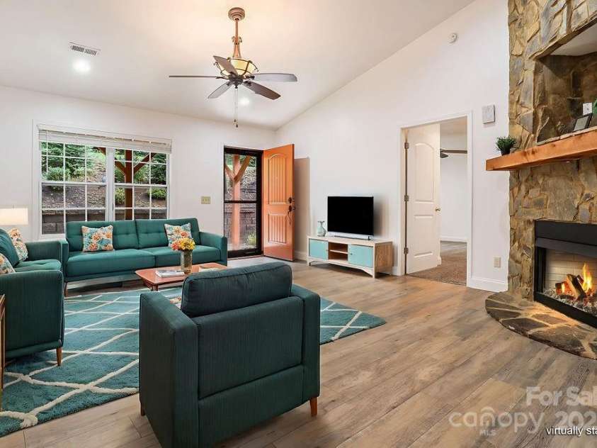 872 Hayes Road, Columbus, NC 28722.  MLS# CAR4291604, YatesRealty ID 33269. Cozy living space with newer flooring and fresh paint throughout (Virtually staged)