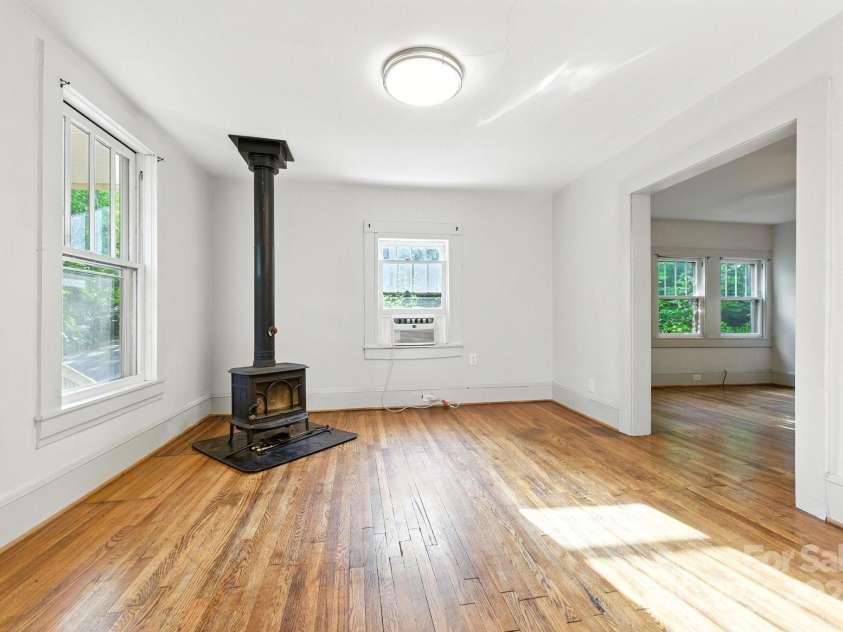 54 Downing Street, Asheville, NC 28806.  MLS# CAR4274017, YatesRealty ID 33273. Jotul Woodstove for winter nights