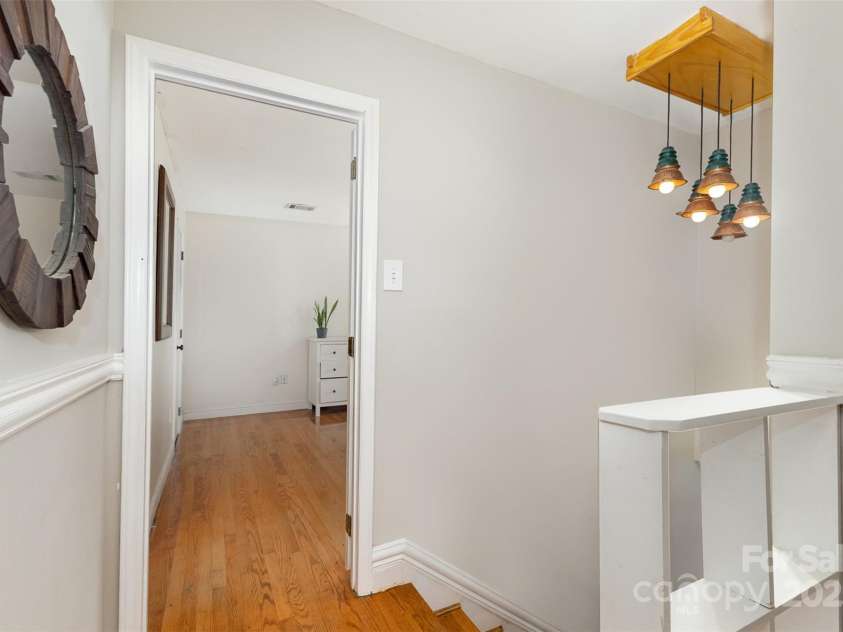 7015 Lavern Street, Charlotte, NC 28215.  MLS# CAR4260772, YatesRealty ID 33280. Upstairs Landing (view toward Primary Bedroom)