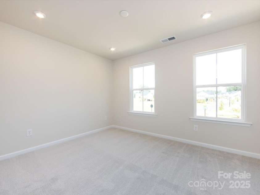 7023 Short Stirrup Lane, Mint Hill, NC 28227.  MLS# CAR4291701, YatesRealty ID 33286. Bedroom 3 facing community green space.