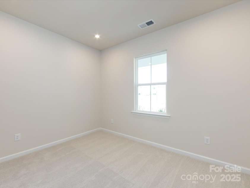 7023 Short Stirrup Lane, Mint Hill, NC 28227.  MLS# CAR4291701, YatesRealty ID 33286. First floor guest bedroom.