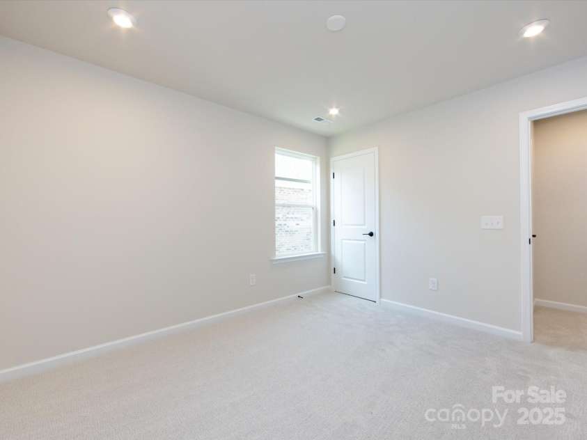 7023 Short Stirrup Lane, Mint Hill, NC 28227.  MLS# CAR4291701, YatesRealty ID 33286. Large bedroom 4.