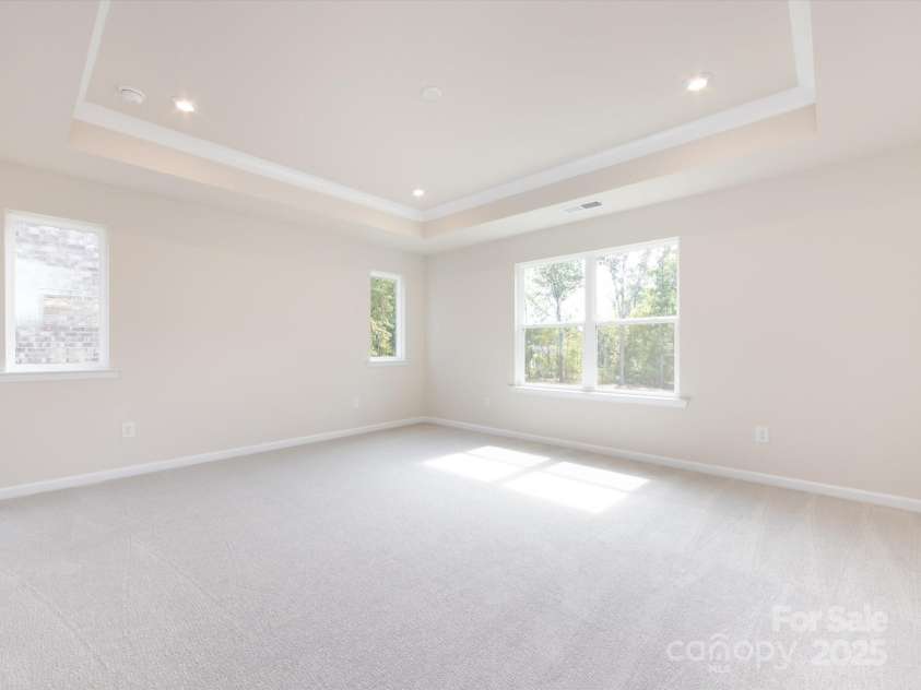 7023 Short Stirrup Lane, Mint Hill, NC 28227.  MLS# CAR4291701, YatesRealty ID 33286. Primary suite seeped in natural light and unobstructed views.