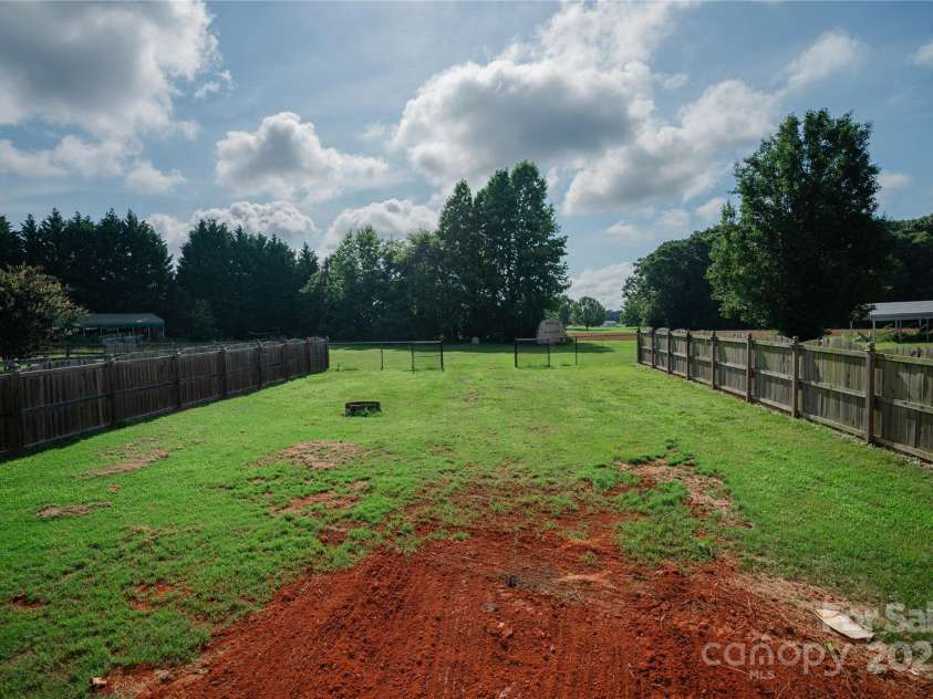 1083 Elljoy Lane, Salisbury, NC 28146.  MLS# CAR4263948, YatesRealty ID 33289. View of fenced in backyard