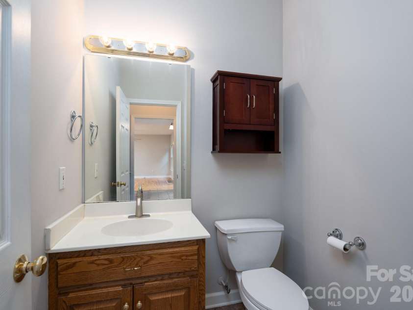 2116 Quail Drive, Concord, NC 28027.  MLS# CAR4389135, YatesRealty ID 33289. 1/2 bath downstairs next to kitchen