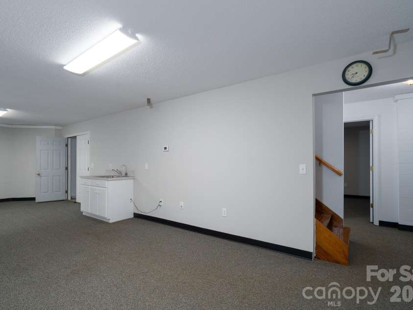 2116 Quail Drive, Concord, NC 28027.  MLS# CAR4389135, YatesRealty ID 33289. Basement area with sink and endless possibilities.