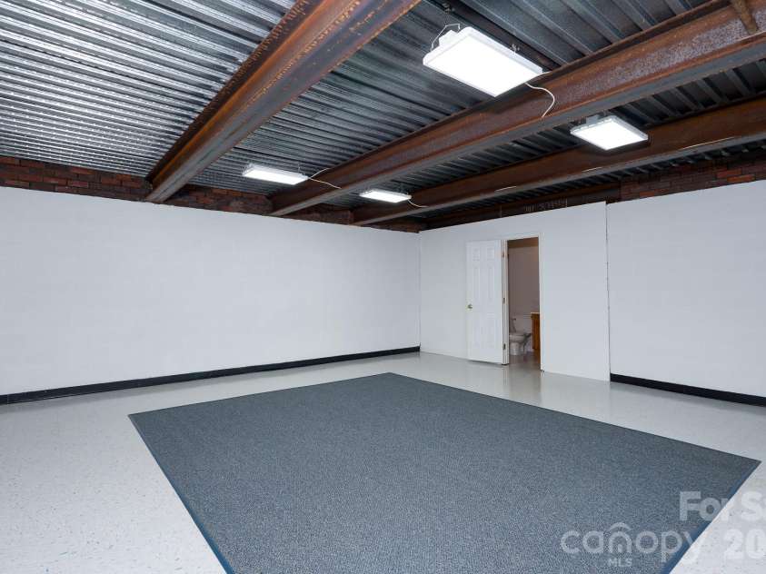 2116 Quail Drive, Concord, NC 28027.  MLS# CAR4389135, YatesRealty ID 33289. Basement bunker room with attached full bath.