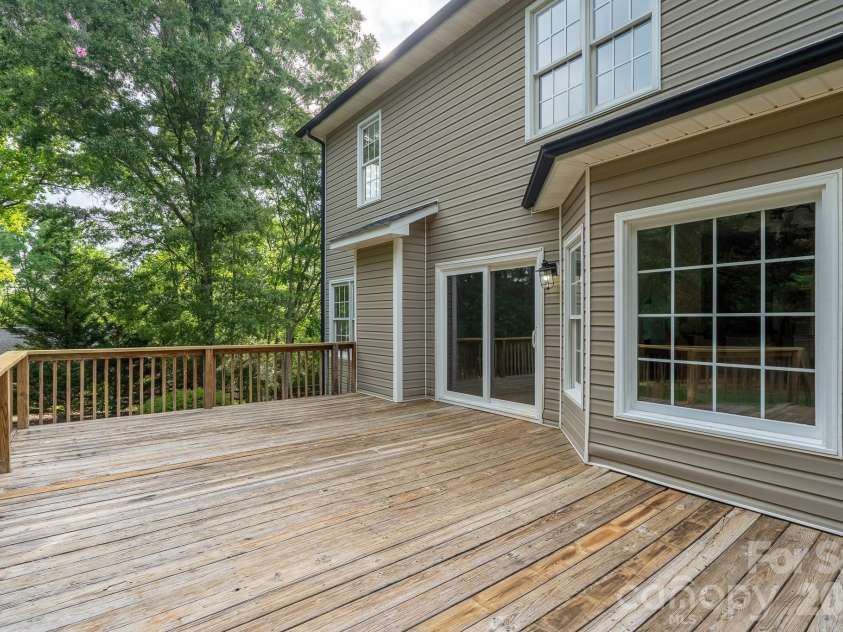 2116 Quail Drive, Concord, NC 28027.  MLS# CAR4389135, YatesRealty ID 33289. Great huge deck for entertaining.