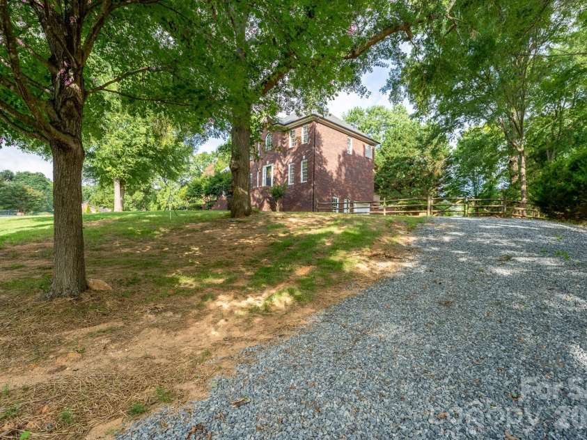 2116 Quail Drive, Concord, NC 28027.  MLS# CAR4389135, YatesRealty ID 33289. Side entrance into basement garage.