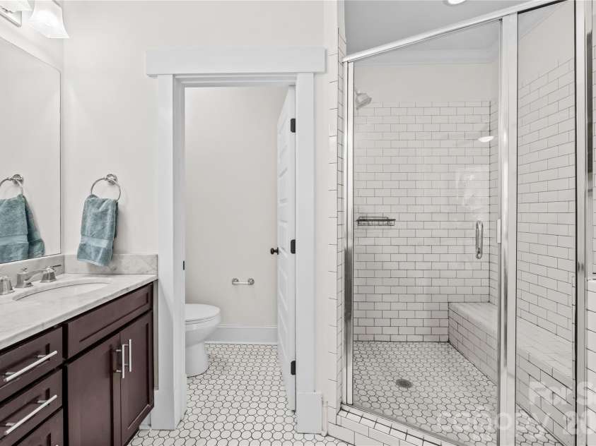 1340 Downs Avenue, Charlotte, NC 28205.  MLS# CAR4387303, YatesRealty ID 33292. Full primary suite bathroom with double vanity.