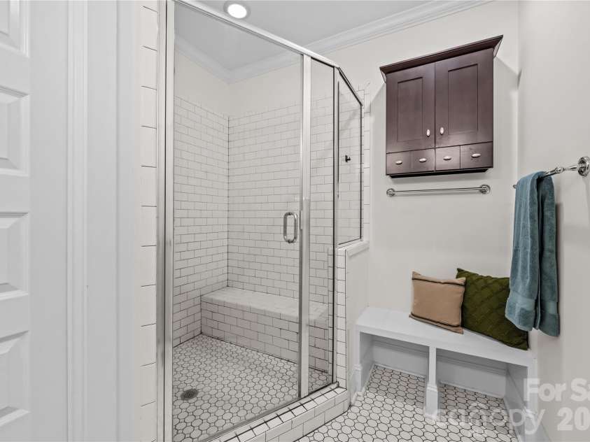1340 Downs Avenue, Charlotte, NC 28205.  MLS# CAR4387303, YatesRealty ID 33292. Large walk-in shower and bench/locker area.