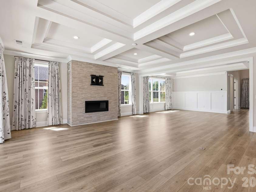 128 Ellison Way, Marvin, NC 28173.  MLS# CAR4394584, YatesRealty ID 33299. Custom Feature wall with Electric Fireplace and Cofferred ceiling