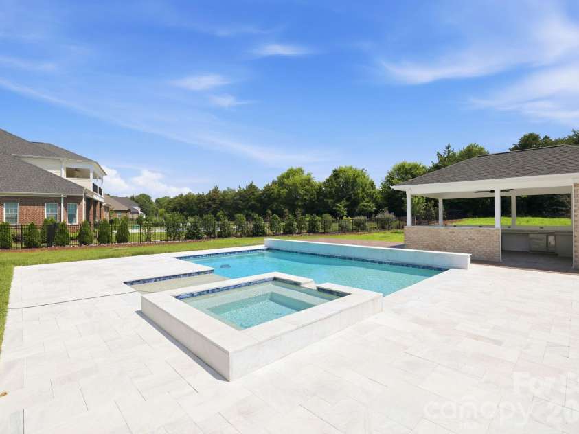 128 Ellison Way, Marvin, NC 28173.  MLS# CAR4394584, YatesRealty ID 33299. Inground Heated Pool and Spa with cascading water feature