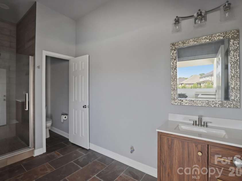128 Ellison Way, Marvin, NC 28173.  MLS# CAR4394584, YatesRealty ID 33299. Pool House Bath with tiled shower