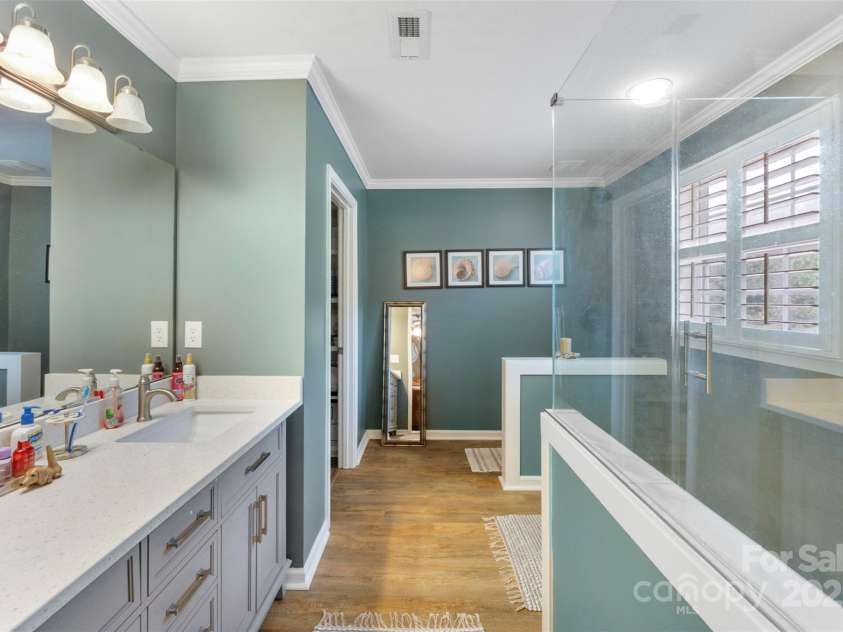 370 Battery Circle, Clover, SC 29710.  MLS# CAR4309546, YatesRealty ID 333. Primary bath with additional walk-in closet with custom shelving! Single vanity for more counter space and LVP flooring for easy care.