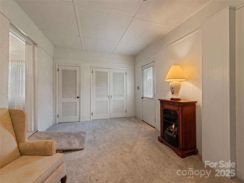 241 Grandview Circle, Waynesville, NC 28786.  MLS# CAR4291843, YatesRealty ID 33300. Den with gas logs
