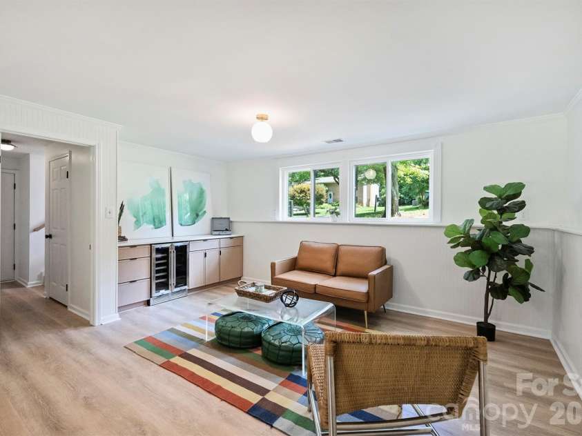 7323 Rollingridge Drive, Charlotte, NC 28211.  MLS# CAR4396254, YatesRealty ID 33306. Downstairs, the expansive second living area offers an additional space for relaxing and entertaining.