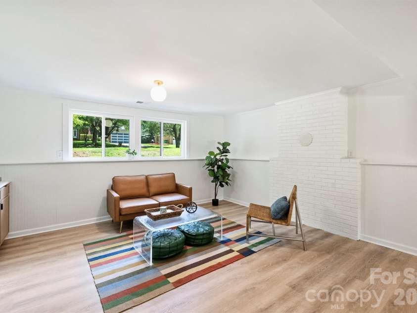 7323 Rollingridge Drive, Charlotte, NC 28211.  MLS# CAR4396254, YatesRealty ID 33306. Lower level living room.
