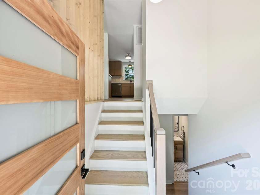 7323 Rollingridge Drive, Charlotte, NC 28211.  MLS# CAR4396254, YatesRealty ID 33306. Step inside through the brand-new front door, offering a sleek, modern aesthetic.The inviting entryway is highlighted by a brand-new front door with sophisticated