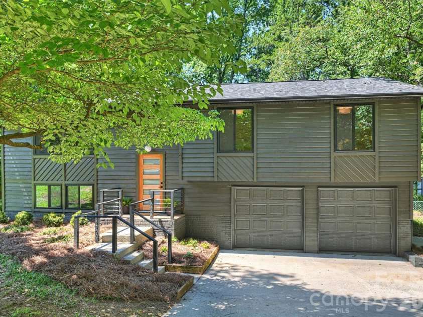 7323 Rollingridge Drive, Charlotte, NC 28211.  MLS# CAR4396254, YatesRealty ID 33306. The attached two-car garage adds even more versatility with a large utility closet that's ideal for a workshop or extra storage.