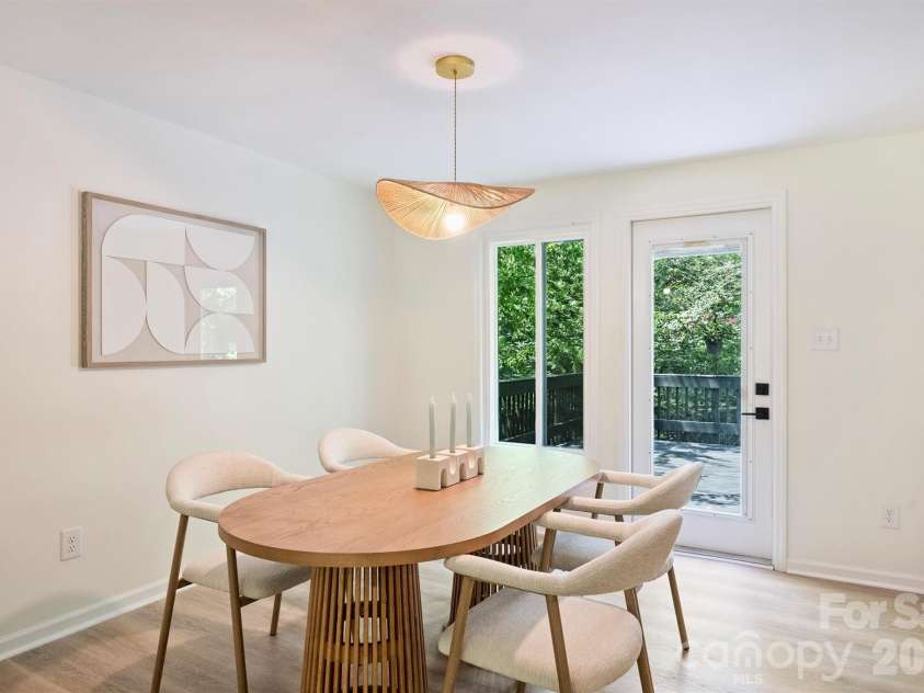 7323 Rollingridge Drive, Charlotte, NC 28211.  MLS# CAR4396254, YatesRealty ID 33306. The spacious dining room features designer lighting and access to the large deck.