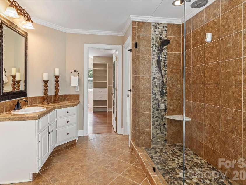 122 Lake Pine Road, Mooresville, NC 28117.  MLS# CAR4397434, YatesRealty ID 33309. Spacious shower in Primary Bath