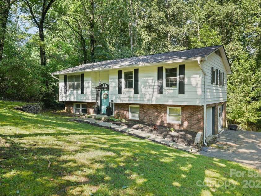 155 Timberlane Drive, Etowah, NC 28729.  MLS# CAR4290050, YatesRealty ID 33313. Another front view with garage