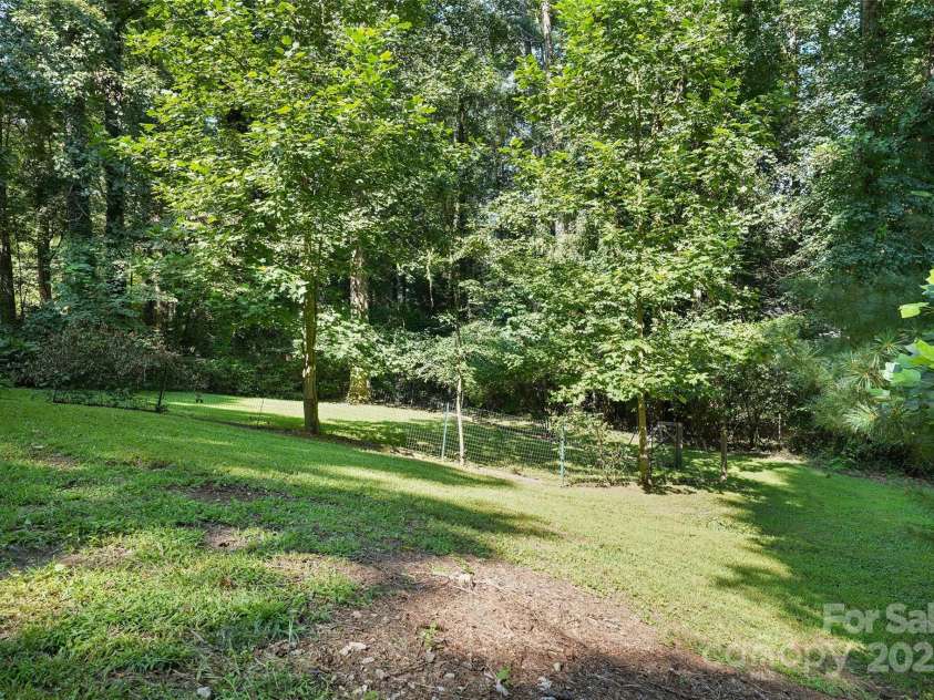155 Timberlane Drive, Etowah, NC 28729.  MLS# CAR4290050, YatesRealty ID 33313. Back yard