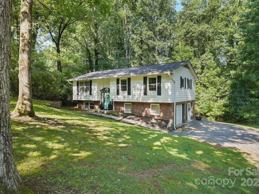 155 Timberlane Drive, Etowah, NC 28729.  MLS# CAR4290050, YatesRealty ID 33313. Home with lots of parking space