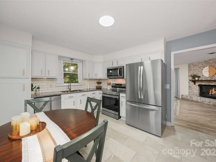 155 Timberlane Drive, Etowah, NC 28729.  MLS# CAR4290050, YatesRealty ID 33313. Kitchen with dining area