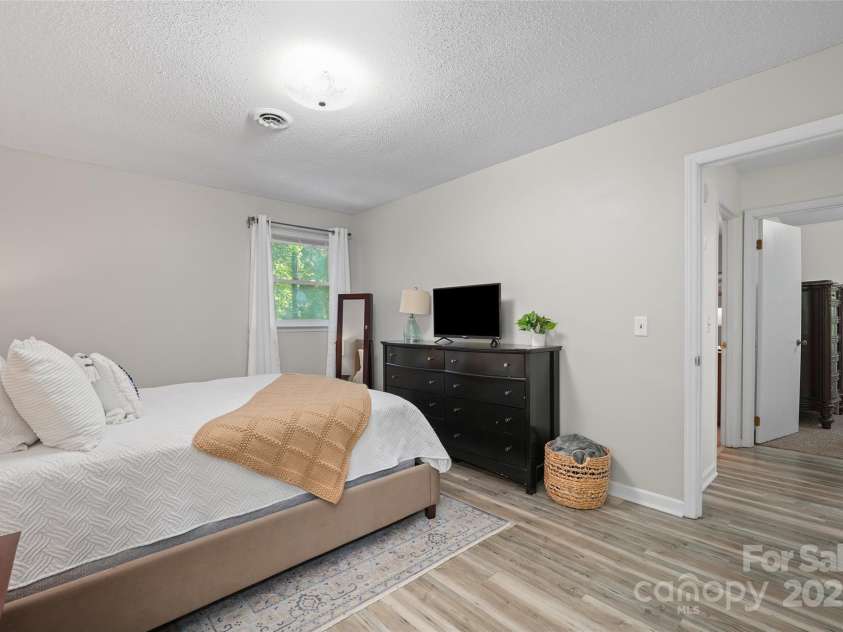 155 Timberlane Drive, Etowah, NC 28729.  MLS# CAR4290050, YatesRealty ID 33313. Primary bedroom