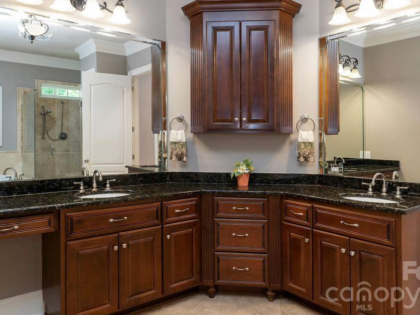 4293 Soaring Eagle Cove Court, Denver, NC 28037.  MLS# CAR4395644, YatesRealty ID 33313. Primary bath with double sinks and granite countertops...