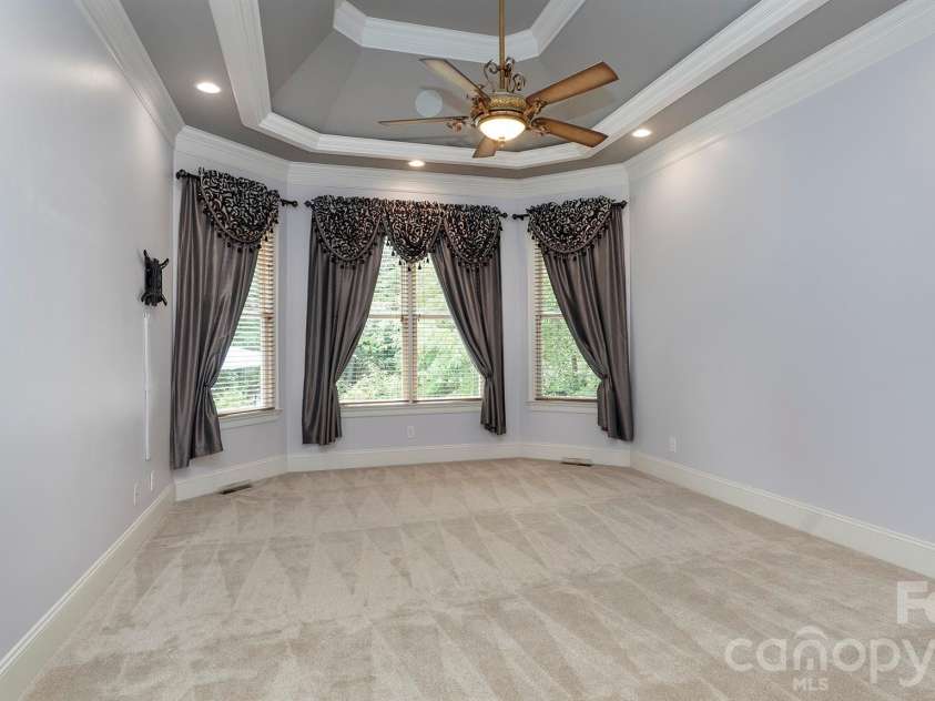 4293 Soaring Eagle Cove Court, Denver, NC 28037.  MLS# CAR4395644, YatesRealty ID 33313. Primary bedroom on main with double tray ceiling...