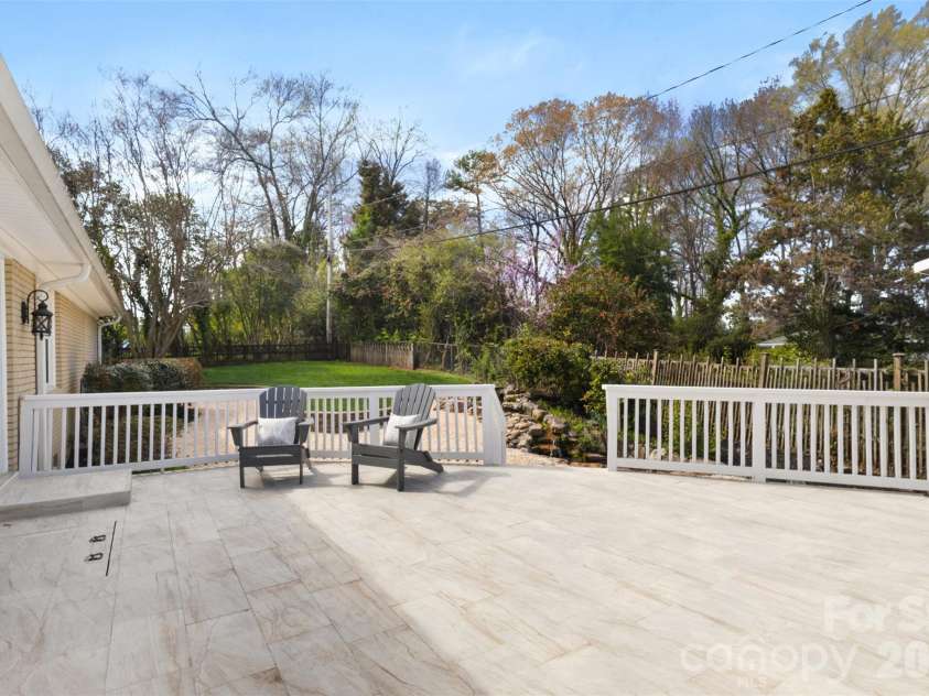 265 Anthony Circle, Charlotte, NC 28211.  MLS# CAR4355827, YatesRealty ID 33319. Expansive Deck Overlooking Waterfall & Pond