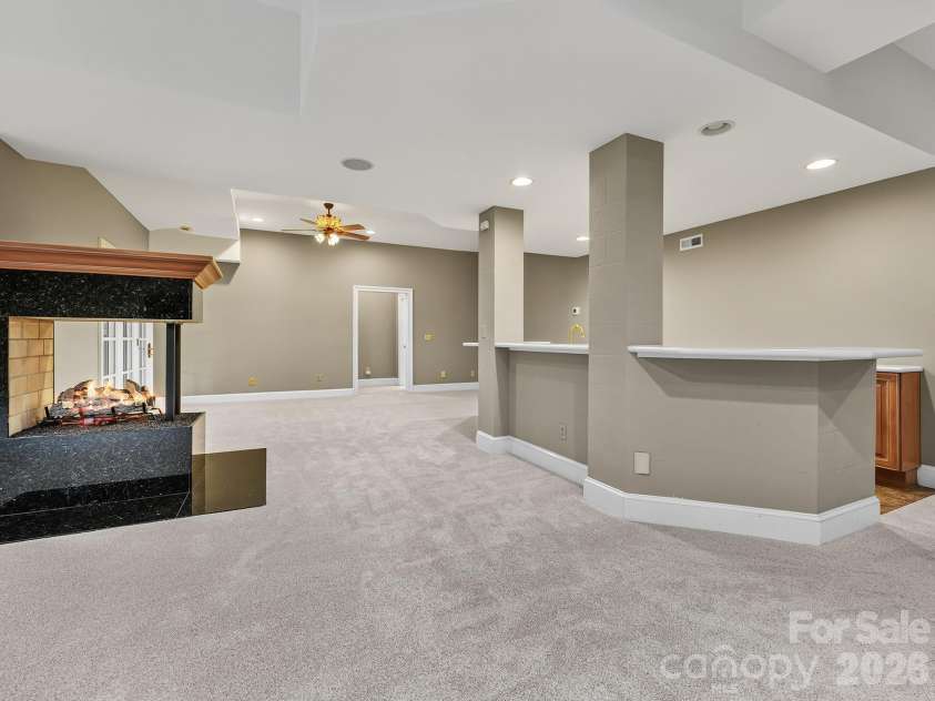 14483 Nolen Lane, Charlotte, NC 28277.  MLS# CAR4364895, YatesRealty ID 33320. Lower level with fireplace