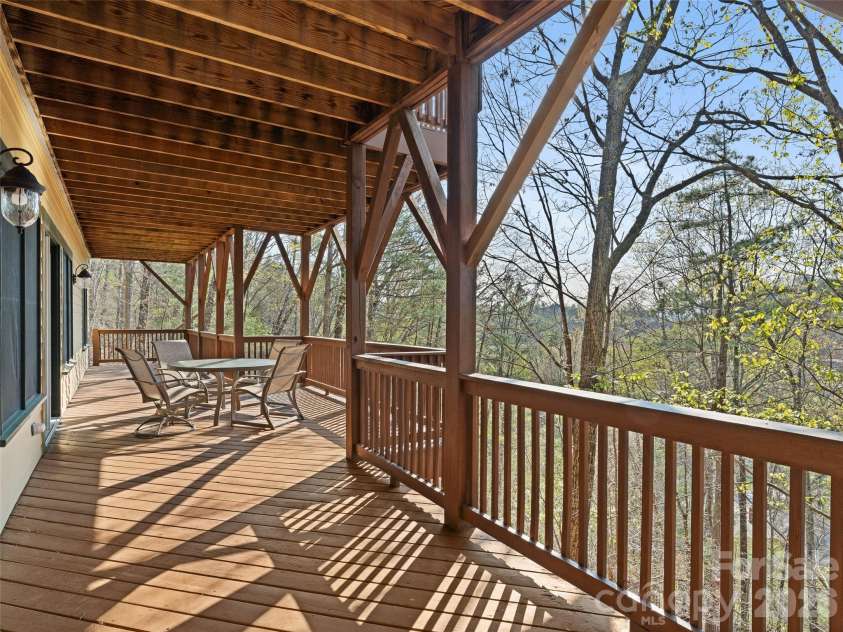 5 Stegall Lane, Asheville, NC 28805.  MLS# CAR4368242, YatesRealty ID 33322. Lower level deck offering mountain views.