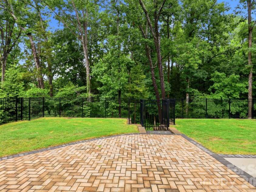 5701 Regal Way, Indian Land, SC 29707.  MLS# CAR4382841, YatesRealty ID 33330. Flat yard with retaining wall