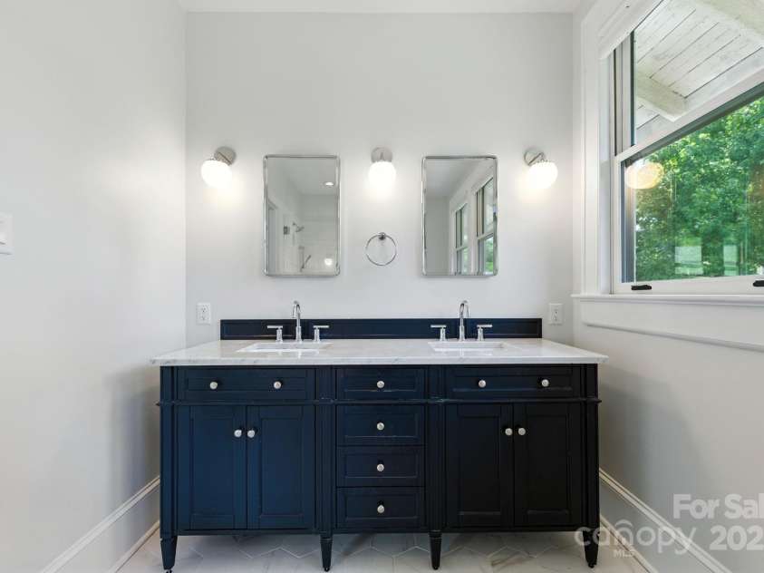 38 Austin Avenue, Asheville, NC 28801.  MLS# CAR4293035, YatesRealty ID 33331. Double vanity with new fixtures and marble countertops