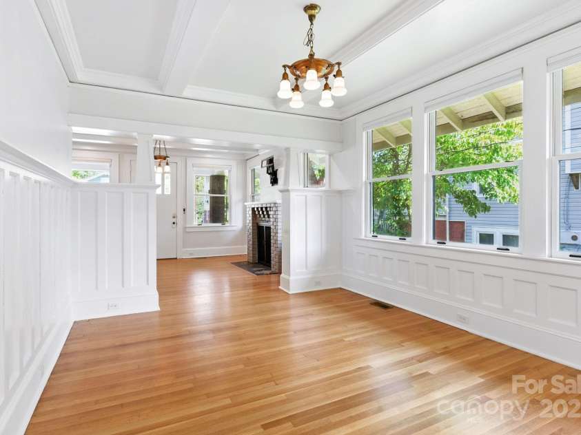 38 Austin Avenue, Asheville, NC 28801.  MLS# CAR4293035, YatesRealty ID 33331. Elegant dining room with craftsman details wainscoting and coffered ceiling