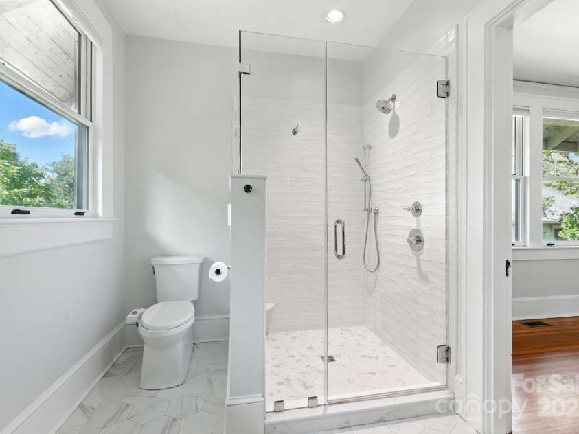 38 Austin Avenue, Asheville, NC 28801.  MLS# CAR4293035, YatesRealty ID 33331. Fully remodeled ensuite bath with new tile shower and flooring