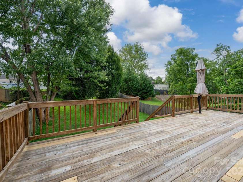 38 Austin Avenue, Asheville, NC 28801.  MLS# CAR4293035, YatesRealty ID 33331. Large deck overlooks fenced backyard