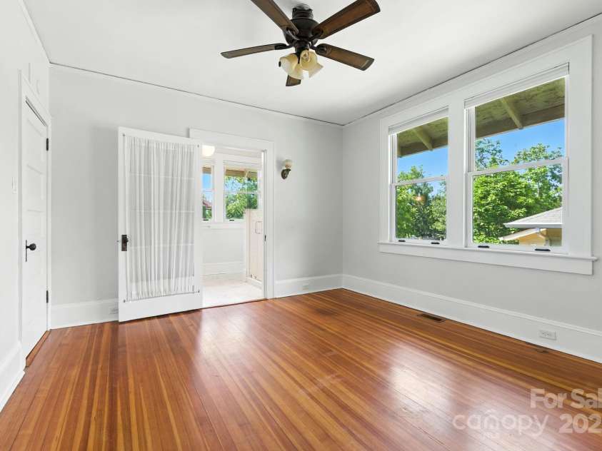 38 Austin Avenue, Asheville, NC 28801.  MLS# CAR4293035, YatesRealty ID 33331. Primary bedroom offer new ensuite bath and ceiling fan
