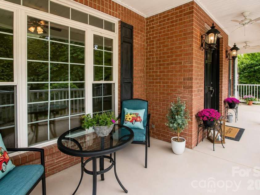 1015 Estate Lane, Matthews, NC 28104.  MLS# CAR4388127, YatesRealty ID 33333. Extra large front porch.