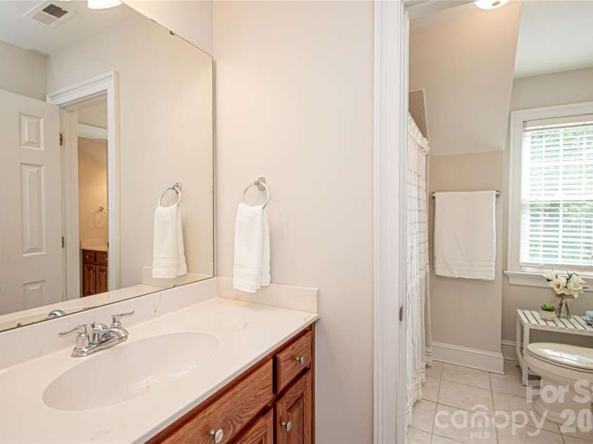 1015 Estate Lane, Matthews, NC 28104.  MLS# CAR4388127, YatesRealty ID 33333. Jack and Jill bathroom.
